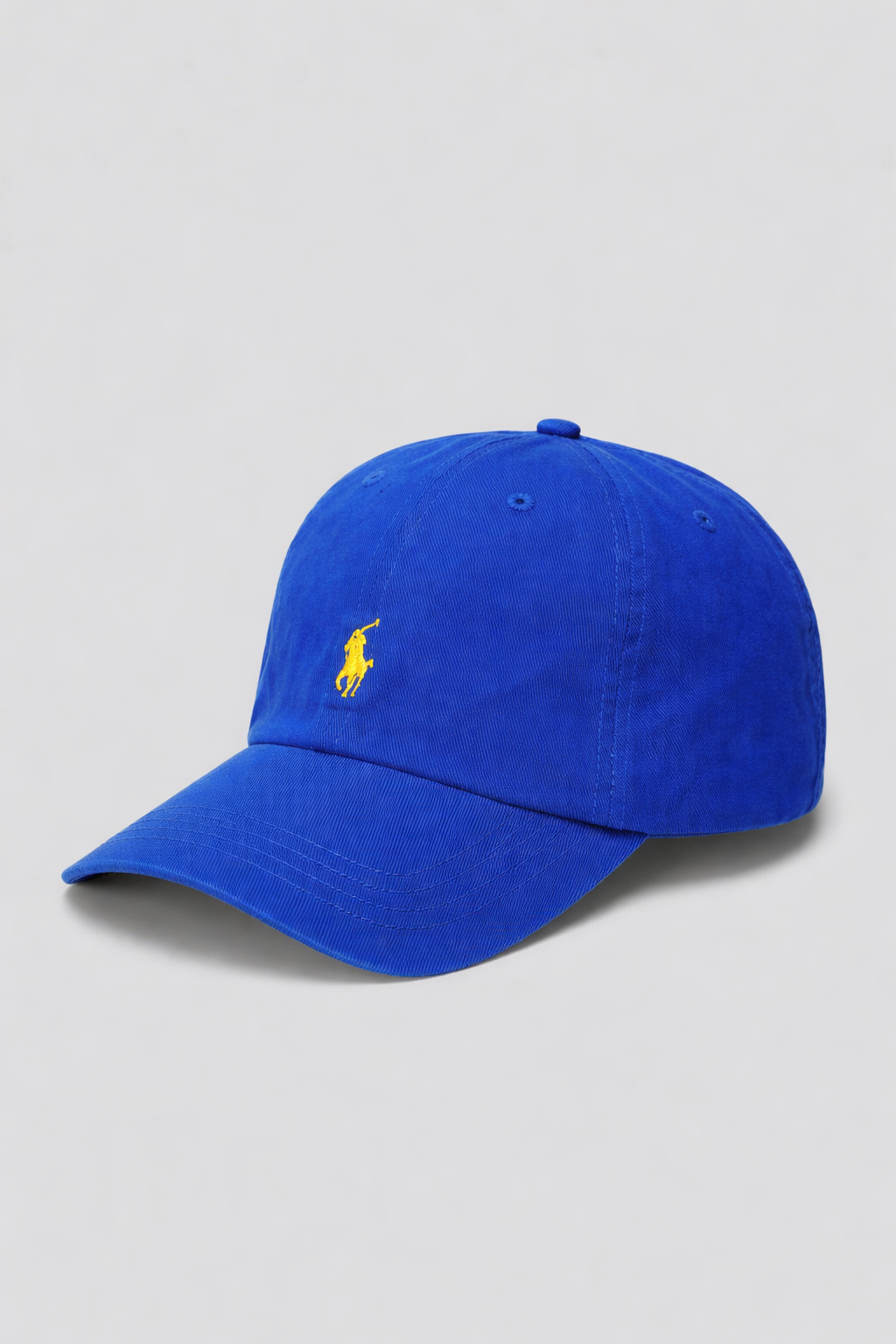 Blue cap with a yellow logo on a light gray background